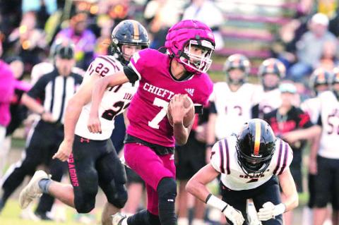 Quarterback Will Lewis drops back top pass. Will Lewis keeps it on the ground with a quarterback keeper.