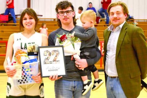 Audrey Newsom was escorted by her brother Carson Britt and nephew Layton. Coach Kirkpatrick made the presentation