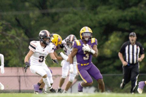 Quarterback Isaiah Drake looks to run the ball.