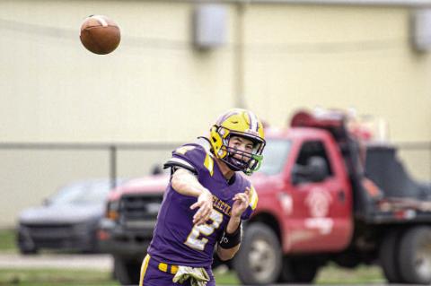 Junior Kellen Sheneman drops back to pass.