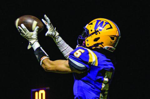 Colt Richards leaps to make the catch.