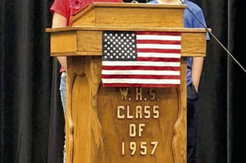Saige Glover and Kayden Puckett speaking about the history of Veterans Day.