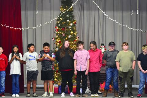 Graham Dustin 5th and 6th graders sing LeRoy the Redneck Reindeer at this year’s Christmas program.