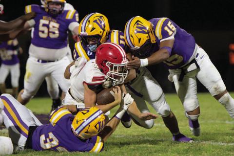 A swarm of Outlaws take down the Wetumka running back.