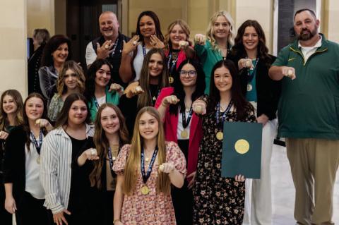 Members of the Stuart High School Lady Hornets Fastpitch Softball team and Head Coach Jeff Parnell and Assistant Coach Rodney Treat show off their 2024 OSSAA Class B State Championship rings at the State Capitol. They were recognized on the House floor by
