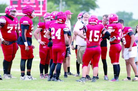 Coach Reid addresses the Chieftains during huddle